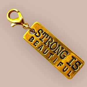 Gold 'Strong is Beautiful' Charm. Handmade NWT backpack, bag, keychain, and etc.